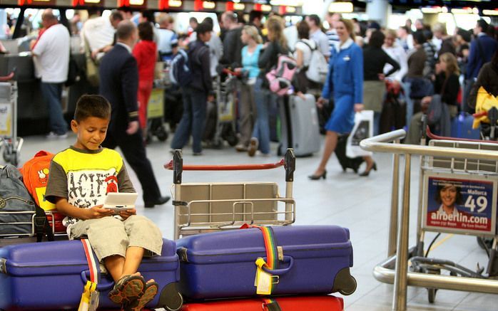 Drukte op de druktste dag van 2007 op Schiphol. Foto ANP