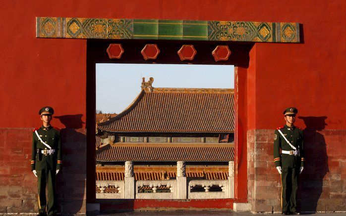 Wachters in de Verboden Stad in Peking, China. De Verboden Stad was jarenlang het onderkomen van leden van de Qingdynastiën. Foto EPA.