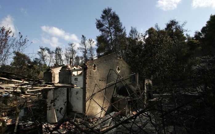 ATHENE – De grote branden die vrijdag tot en met dinsdag woedden in Griekenland, hebben zeker 65 huizen in de as gelegd. Ruim 140 huizen raakten in meer of mindere mate beschadigd. Dat meldde het ministerie van Milieu donderdag. Foto EPA