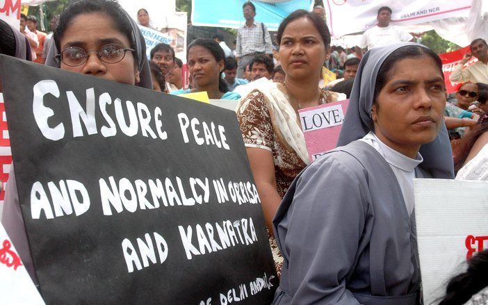 Duizenden christenen hebben donderdag in de Indiase hoofdstad New Delhi een protestmars gehouden. foto EPA