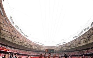 Het voor de Olympische Spelen gebouwde stadion in Peking, bijgenaamd 'het vogelnest'. Foto EPA
