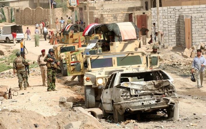 Irakese veiligheidstroepen in TarAfar waar donderdag een zelfmoordaanslag werd gepleegd. Foto EPA