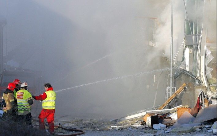 Door een aardverschuiving is een appartementengebouw in Alesund ingestort. Foto's EPA