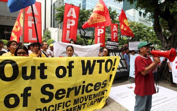 Demonstranten bij de WTO-top. - Foto EPA