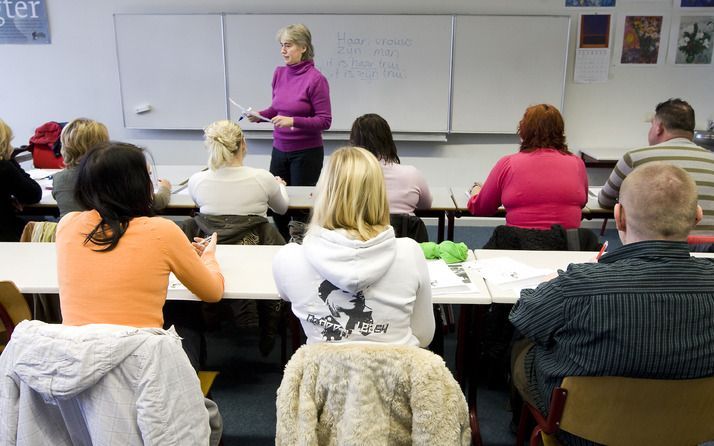 Polen krijgen een cursus Nederlandse taal. Foto ANP