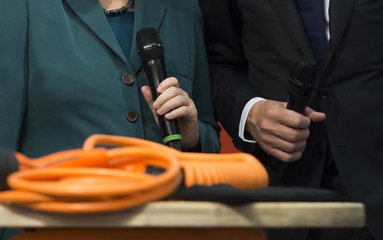 Merkel en Rutte. Foto AFP