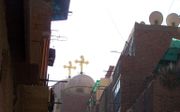 Een koptische kerk in de volkswijk Imbaba in Caïro. beeld RD