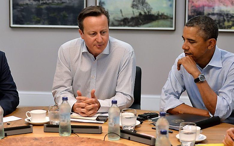 De Russische president Poetin, de Britse premier Cameron en de Amerikaanse president Obama (VLNR) tijdens een ontmoeting van de G8 in juni. Foto EPA