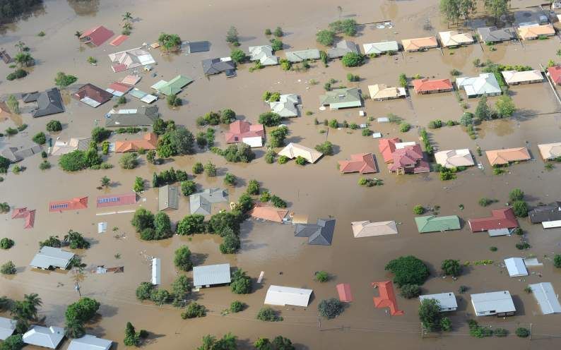 Overstroomde huizen in Brisbane. Foto EPA