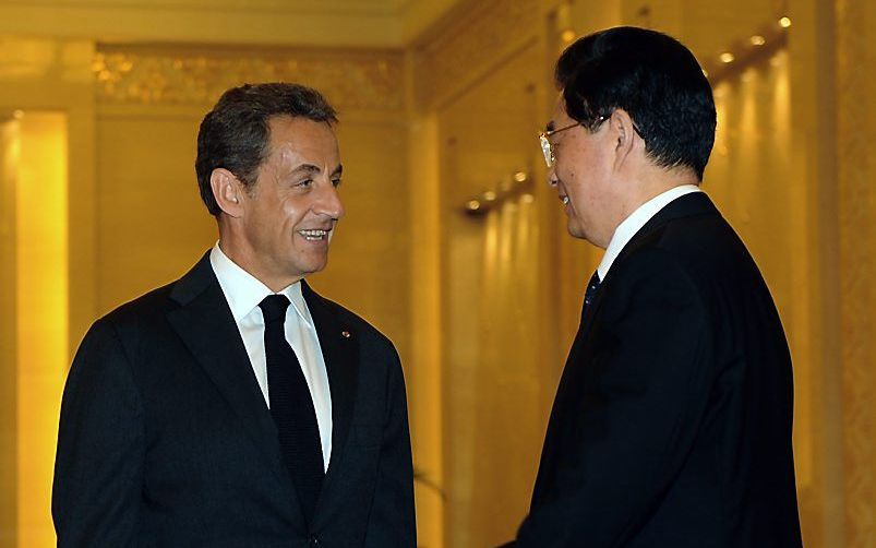 De Franse president Nicolas Sarkozy en de Chinese president Hu Jintao. Foto EPA