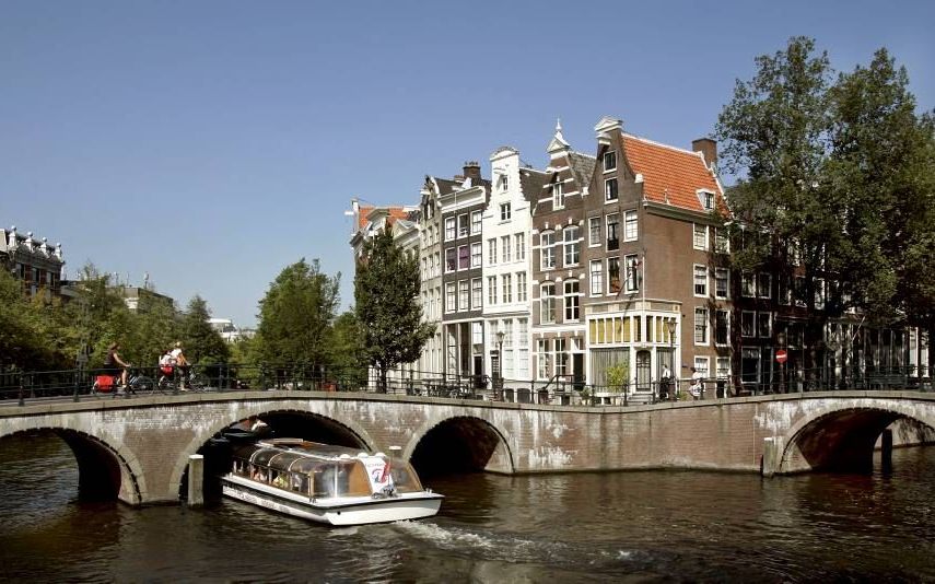 De aanleg van de Amsterdamse grachtengordel begon 400 jaar geleden, in 1612. Het gebied is sindsdien toonaangevend voor de hoofdstad. Afbeelding: de hoek Keizersgracht (l.) en Leidsegracht. Foto ANP