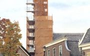 De toren van de hervormde kerk in Kockengen staat in de steigers.  beeld Voegbedrijf Heldoorn