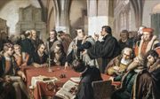 Luther en Zwingli in 1529 in debat over het heilig avondmaal. beeld Wikimedia