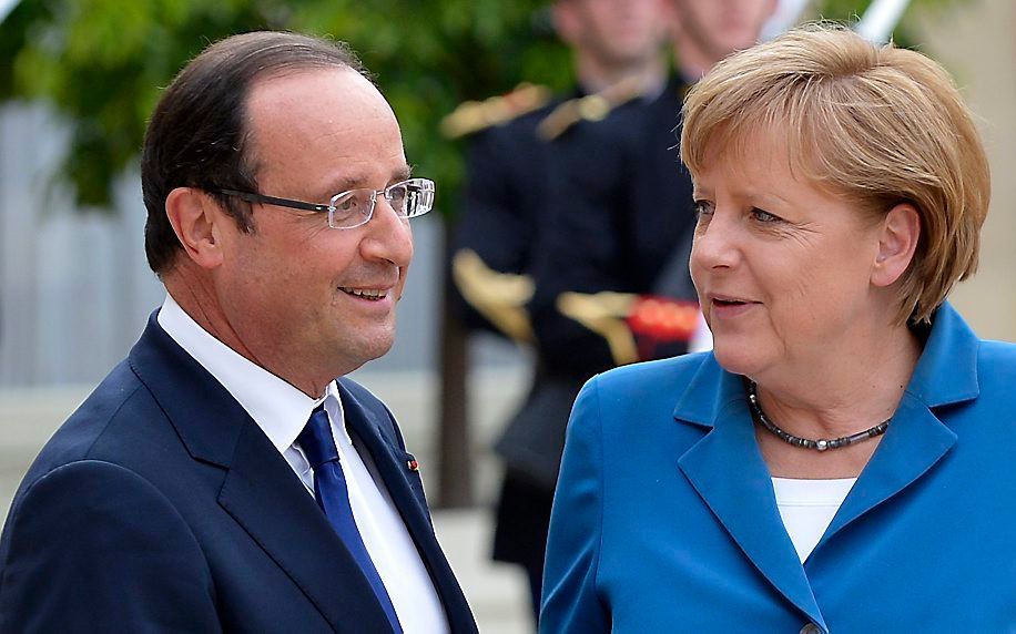 Merkel (r.) en Hollande. Foto EPA