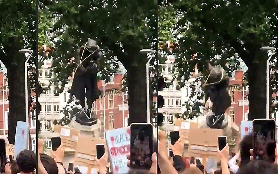 Compilatie van beelden van het omvertrekken van een standbeeld van de 17e eeuwse slavenhandelaar Edward Colston in Bristol. beeld AFP