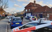 Politie doet onderzoek na een schietpartij in een huis aan de Van Leeuwenhoekstraat in Enschede, waarbij meerdere doden zijn gevallen. beeld ANP