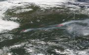 Luchtfoto van natuurbranden in Alaska in 2019. beeld AFP