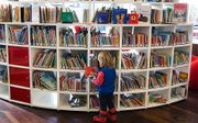 Kinderboeken op de afdeling Jeugd van de Openbare Bibliotheek van Amsterdam. beeld ANP, Koen Suyk