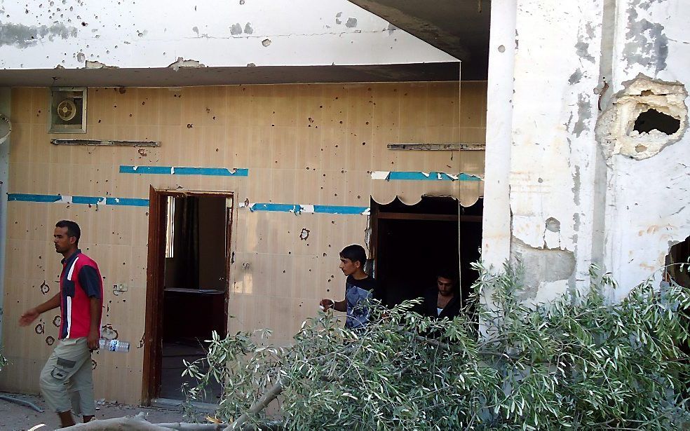 Talloze kogelgaten in een huis in Tremseh, Syrië. Foto EPA