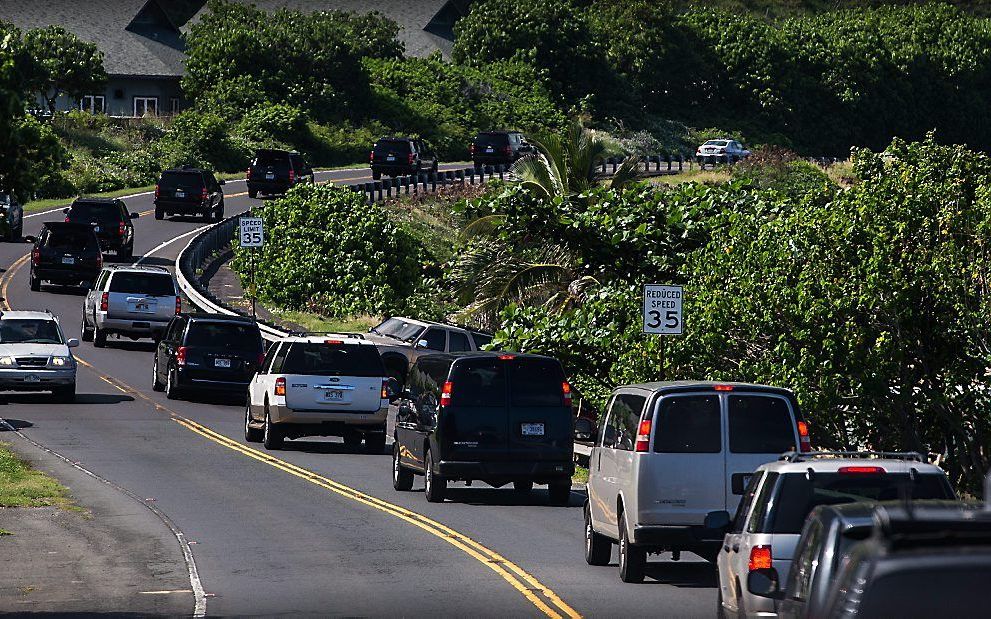 Terugkeer van een presidentieel uitstapje naar Honolulu. beeld EPA