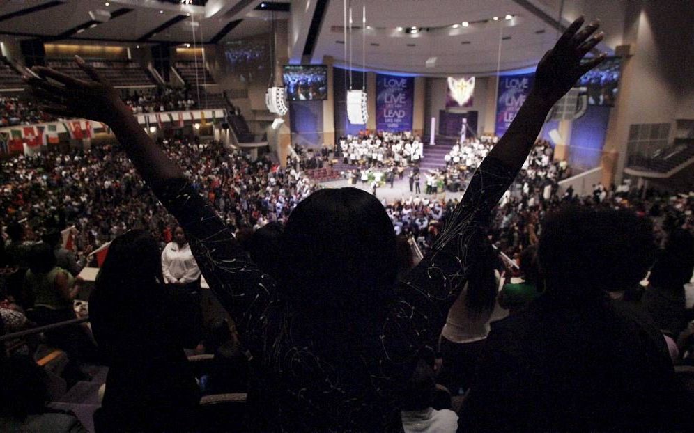 Op de Hampton University in de Amerikaanse staat Virginia zijn deze week 7000 niet-blanke predikanten en koorleiders bij elkaar voor een predikantenconferentie die honderd jaar bestaat. Foto: dienst in een Amerikaanse ‘zwarte’ kerk. beeld EPA