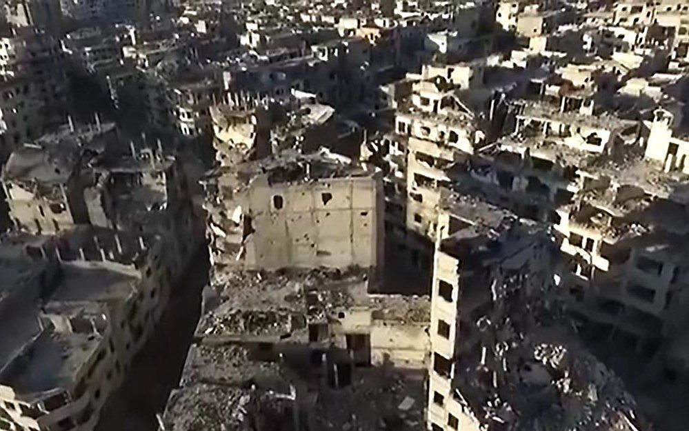 Het verwoeste Homs. beeld uit video YouTube